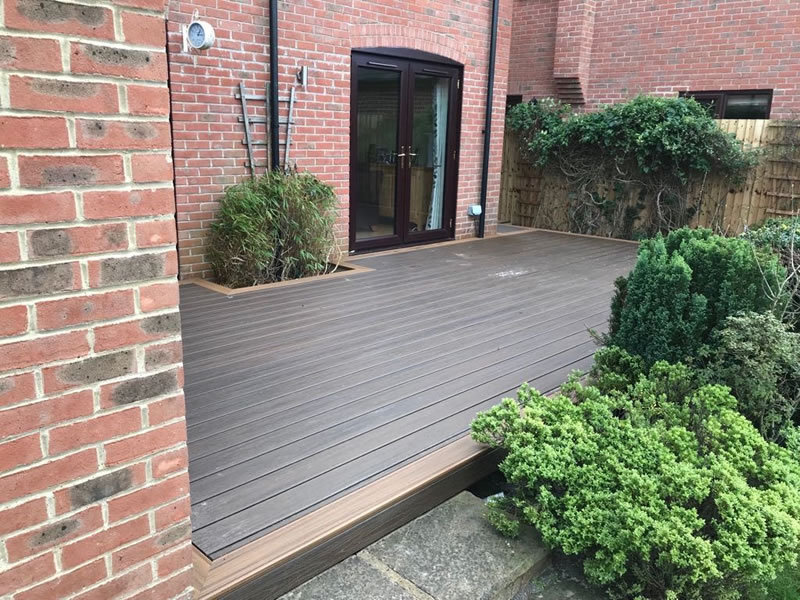 Trek Decking In Worminghall. Centre – Tiki Torch. Border – Spiced Rum